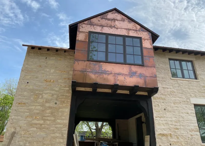 Copper metal panel facade on a stone building for Metal Roof Coating in Sturbridge